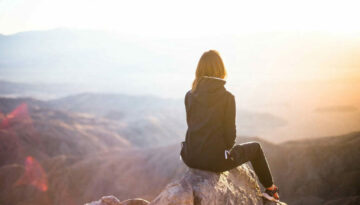 girl-at-top-of-mountain